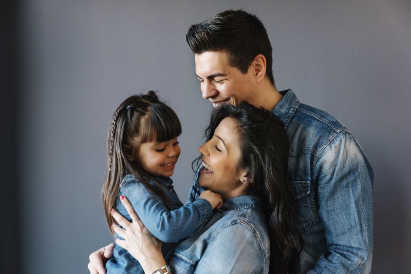 Smiling family embracing each other