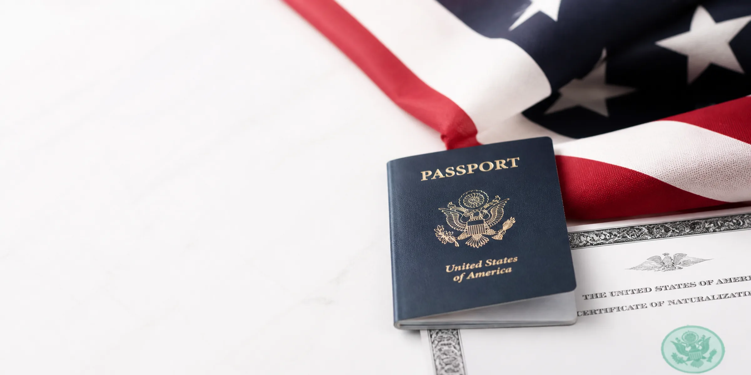 U.S. passport, American flag, and citizenship documents representing naturalization